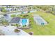 Beautiful aerial view of the community pool, tennis court, playground, and surrounding homes at 4759 Lathloa Loop, Lakeland, FL 33811