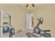 Spacious exercise room features equipment for fitness and a closet for storage at 4759 Lathloa Loop, Lakeland, FL 33811