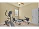 Bright exercise room with ceiling fan features several machines and equipment for your personal fitness needs at 4759 Lathloa Loop, Lakeland, FL 33811