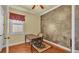 Well-lit office featuring hardwood floors, custom wall design, crown molding, and a classic wooden desk at 4759 Lathloa Loop, Lakeland, FL 33811