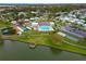 Aerial shot of the community pool, clubhouse, tennis courts, and lush landscaping at 4985 Deerwood Dr, Lakeland, FL 33810