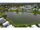 Breathtaking aerial view of the community lake with a fountain, walking path, and manicured landscaping at 4985 Deerwood Dr, Lakeland, FL 33810