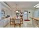 Bright dining room featuring ample storage space and a view of the eat-in kitchen at 4985 Deerwood Dr, Lakeland, FL 33810