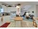 The eat-in kitchen features white cabinetry and an open view into the brightly lit living room at 4985 Deerwood Dr, Lakeland, FL 33810