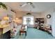 Cozy living room with lots of natural light, complemented by floral accents and a ceiling fan at 4985 Deerwood Dr, Lakeland, FL 33810