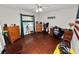 Bedroom featuring wood floors, a ceiling fan, and lots of space for storage at 5051 Ironwood Trl, Bartow, FL 33830