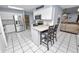 Bright eat-in kitchen with stainless appliances and convenient breakfast bar seating at 5051 Ironwood Trl, Bartow, FL 33830