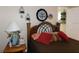 Bedroom with warm tones and decorative wall art above the comfortable looking bed with pillows at 5636 Old Highway 37, Lakeland, FL 33811