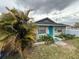 Exterior view of cozy home surrounded by lush greenery in the front yard at 5636 Old Highway 37, Lakeland, FL 33811