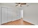 Bright bedroom with natural light, a ceiling fan, double closets, and neutral colors provides a peaceful retreat at 615 Carey Pl, Lakeland, FL 33803