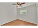 Empty bedroom features wood floors and a bright window at 615 Carey Pl, Lakeland, FL 33803