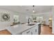 Kitchen with stainless appliances and quartz countertop/ breakfast bar at 615 Carey Pl, Lakeland, FL 33803