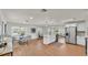 Bright, open-concept kitchen with white cabinets, a center island, and stainless steel appliances at 615 Carey Pl, Lakeland, FL 33803