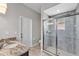 Bathroom with a modern vanity and a glass-enclosed tiled shower at 6185 Gracie Pl, Lakeland, FL 33812