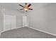 Spacious bedroom featuring a closet and a ceiling fan at 6185 Gracie Pl, Lakeland, FL 33812