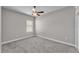 Bedroom with gray walls, carpet and a ceiling fan at 6185 Gracie Pl, Lakeland, FL 33812