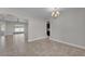 Dining space featuring tile flooring, fresh paint, with views to the outdoor patio and kitchen area at 6185 Gracie Pl, Lakeland, FL 33812