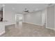 Spacious living room features neutral paint, tile floors, recessed lighting, and access to other rooms at 6185 Gracie Pl, Lakeland, FL 33812