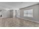 Bright and airy living room featuring tile floors, natural light, and neutral paint, ready for personalization at 6185 Gracie Pl, Lakeland, FL 33812