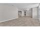 Open-concept living area featuring tile floors and fresh paint, blending seamlessly with the kitchen at 6185 Gracie Pl, Lakeland, FL 33812