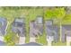 Aerial view of backyard with a screen-enclosed pool and lush green lawns at 6923 Highlands Creek Ave, Lakeland, FL 33813