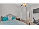 Bedroom featuring plush carpet and view of hallway and a metal decorative bed frame at 6923 Highlands Creek Ave, Lakeland, FL 33813