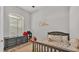 Neutral bedroom with a gray dresser and fun bedding at 6923 Highlands Creek Ave, Lakeland, FL 33813