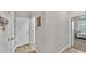 Hallway with wood flooring, leading to the bedroom at 6923 Highlands Creek Ave, Lakeland, FL 33813