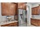 Close-up of modern kitchen appliances with granite countertops and custom cabinetry at 6923 Highlands Creek Ave, Lakeland, FL 33813