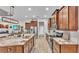 Modern kitchen featuring a large island, granite countertops, and stainless-steel appliances at 6923 Highlands Creek Ave, Lakeland, FL 33813