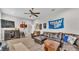 Living room area featuring a leather sofa, cabinet, and Titan's decor at 6923 Highlands Creek Ave, Lakeland, FL 33813