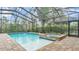 A pool with a spa featuring brick flooring inside of a screened in enclosure at 6923 Highlands Creek Ave, Lakeland, FL 33813