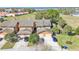 Aerial view of townhome showing well-manicured lawn and landscaping at 707 Carpenters Way # 37, Lakeland, FL 33809