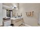 Bathroom featuring a vanity with a sink, toilet, and decorative accents at 707 Carpenters Way # 37, Lakeland, FL 33809