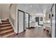 Hallway with wood-look tile, stairs, and access to the bathroom and kitchenette at 707 Carpenters Way # 37, Lakeland, FL 33809