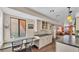 This kitchen features a breakfast bar, stylish pendant lights and views of the living area at 707 Carpenters Way # 37, Lakeland, FL 33809