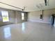 Spacious garage with neutral walls, windows, and a water heater providing ample parking and storage at 7903 Lake James Blvd, Lakeland, FL 33810