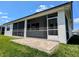 Screened patio overlooking the yard; perfect for entertaining, grilling, and relaxing outdoors at 7903 Lake James Blvd, Lakeland, FL 33810