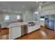 Open kitchen featuring a large island with a stainless steel sink and granite countertops at 8160 Lake James Dr, Lakeland, FL 33810