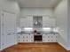 Modern kitchen with black granite counters, subway tile backsplash, and stainless steel appliances at 8160 Lake James Dr, Lakeland, FL 33810