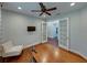 Home office featuring hardwood floors, a ceiling fan, and glass French doors at 8160 Lake James Dr, Lakeland, FL 33810