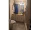 Bathroom featuring a toilet, a vanity with drawers and sink, and a framed mirror at 1007 Forest Lake Dr, Lakeland, FL 33809