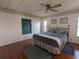 Bedroom features a comfortable bed, hardwood floors, and natural light, offering a peaceful retreat at 1007 Forest Lake Dr, Lakeland, FL 33809