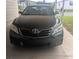 Close-up front view of a black Toyota Camry car parked on the driveway at 1007 Forest Lake Dr, Lakeland, FL 33809