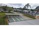 Aerial view showcasing the community's shuffleboard courts and inviting swimming pool at 1007 Forest Lake Dr, Lakeland, FL 33809