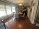 Inviting dining area with warm wooden flooring and an attractive chandelier at 1007 Forest Lake Dr, Lakeland, FL 33809