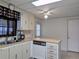 Efficient kitchen with stainless steel sink, wood countertops, and bright lighting at 1007 Forest Lake Dr, Lakeland, FL 33809