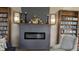 Community library featuring a modern electric fireplace, bookshelves, and comfortable seating at 1007 Forest Lake Dr, Lakeland, FL 33809