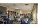 Community library featuring a fireplace, cozy seating, and floor to ceiling bookshelves at 1007 Forest Lake Dr, Lakeland, FL 33809