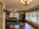 Bright living room with wood floors, large windows, and comfortable furnishings at 1007 Forest Lake Dr, Lakeland, FL 33809